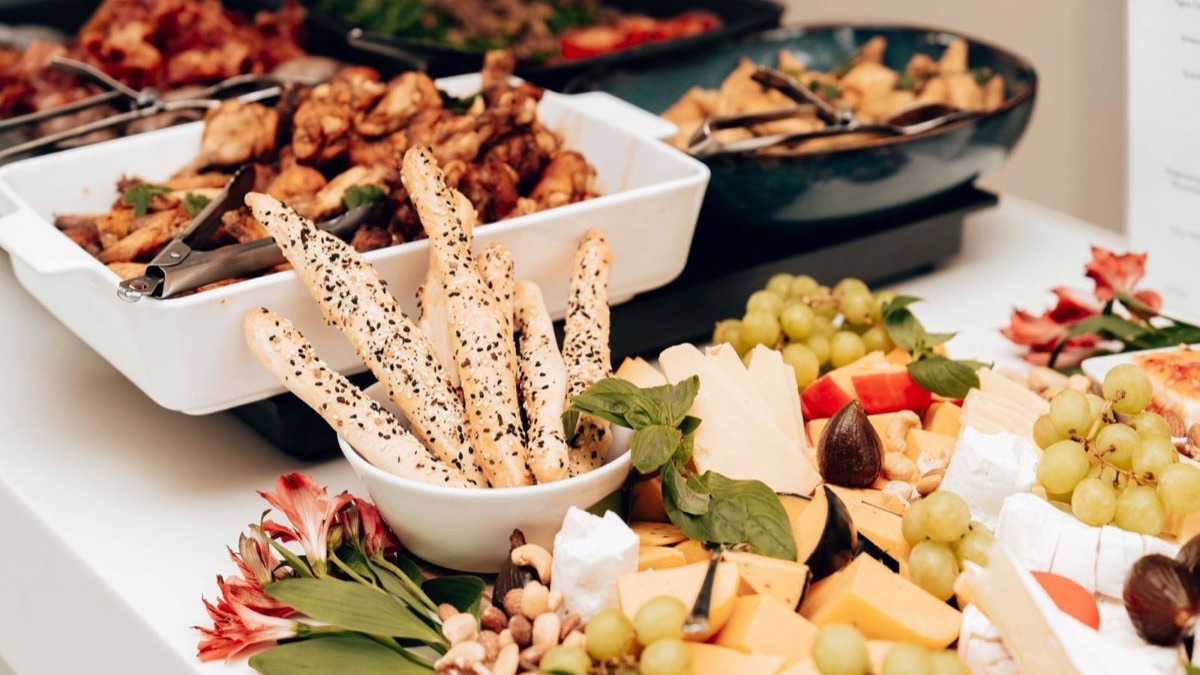 Buffet catering counter laid out with food at an event